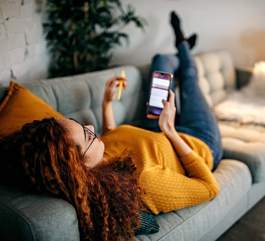 Woman signing up for online banking with Red Canoe