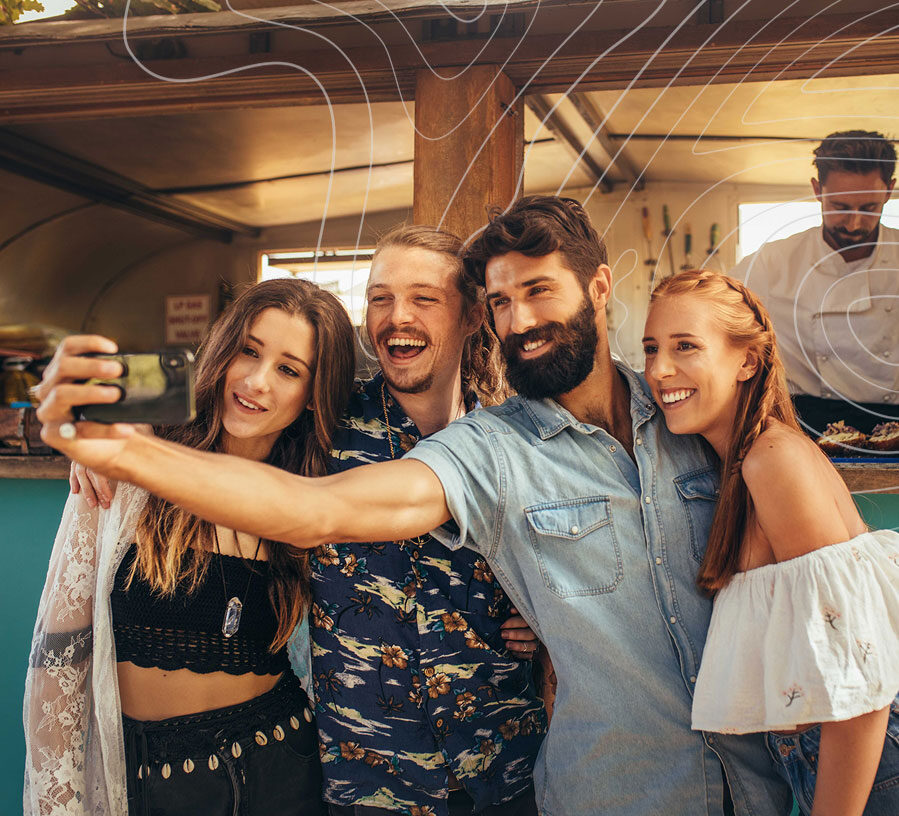 Friends with VISA Credit Cards from Red Canoe taking a selfie at a restaurant